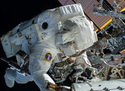 Astronaut wearing EVA suit.